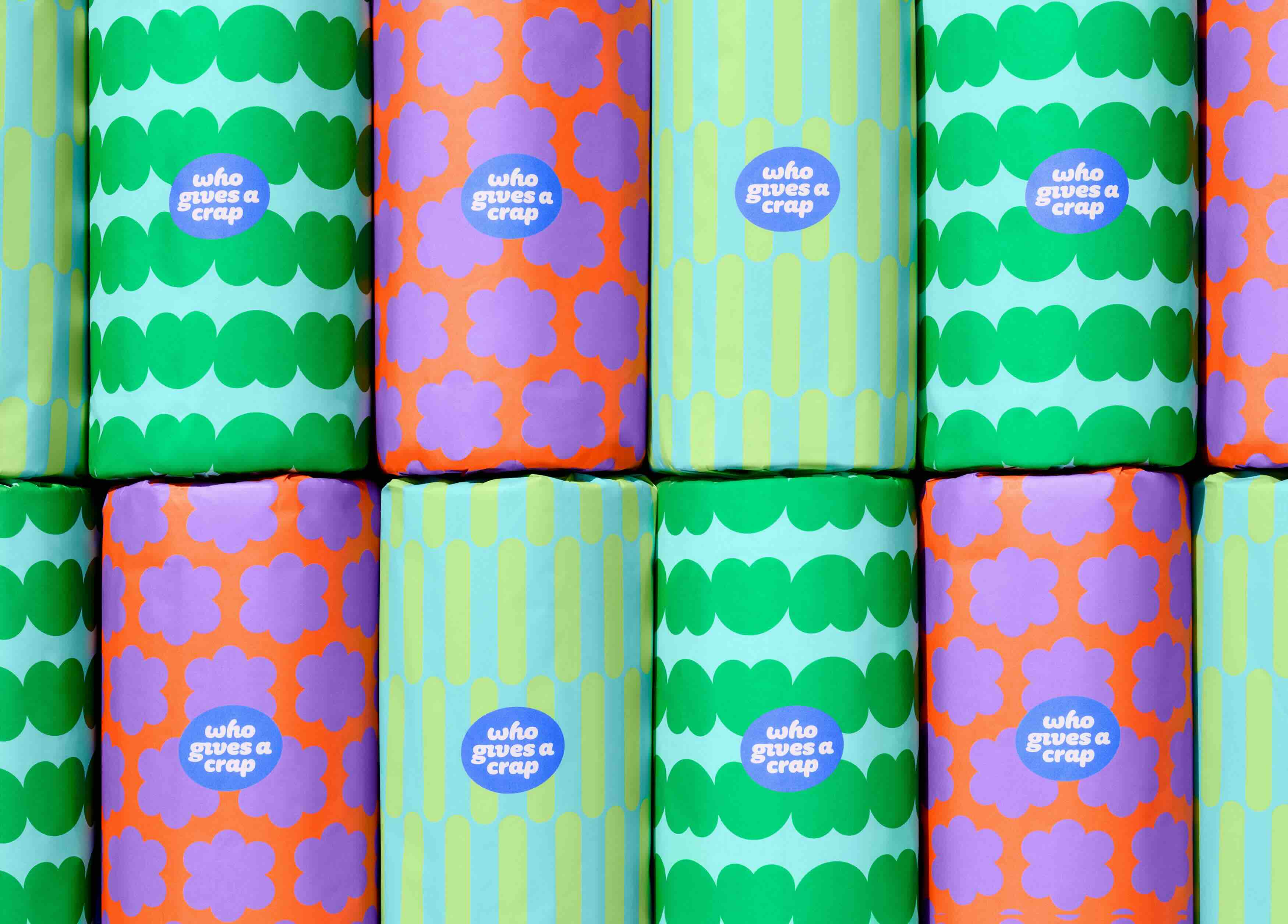 16 boxes of paper towels neatly stacked to showcase multiple colourful wrappers